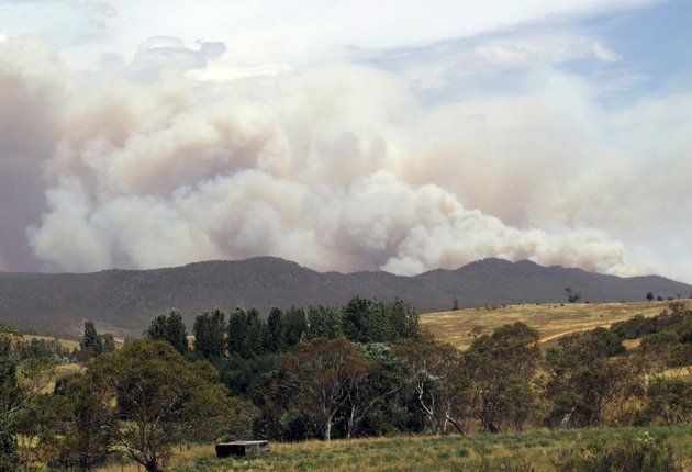 wildfire-smoke-rises-from-hills-near-the-village-of-numeralla-in-new-south-wales-state-on-tuesday-jan-8-2013-wildfires-raged-across-much-of-southeast-australia