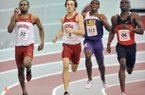 University of Arkansas runners Akheem Gauntlett (left) and Neil Braddy return from the 4x400 relay team that won the NCAA championship in 2012. 