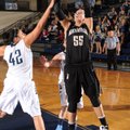 Julia Garrard, right, a Bentonville senior, takes a shot Tuesday in the lane as Springdale Har-Ber s...