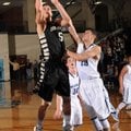 Nick Smith, a Bentonville senior, scores as Springdale Har-Ber junior Brandon Buccheri defends Tuesd...