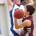 Raul Leyva, right, of Siloam Springs goes up for the shot as Brett Gentz of Rogers goes up to block ...