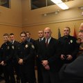 Seven new Bentonville police officers, from left, Kevin Albert, Ben Peters, Andy Oliver, Nicholas Br...
