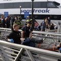 New York City firefighters remove an injured passenger of the Seastreak Wall Street ferry, in New Yo...