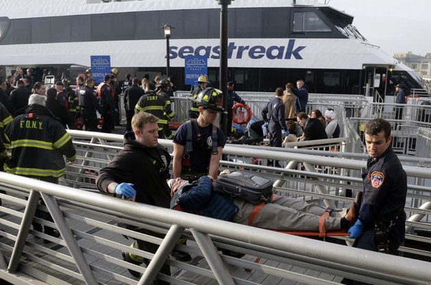 new-york-city-firefighters-remove-an-injured-passenger-of-the-seastreak-wall-street-ferry-in-new-york-wednesday-jan-9-2013-the-seastreak-wall-street-ferry-from-atlantic-highlands-nj-banged-into-the-mooring-as-it-arrived-at-south-street-in-lower-manhattan-during-morning-rush-hour-injuring-as-many-as-50-people-at-least-one-critically-officials-said