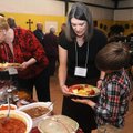 Irene Boomhower, left, dishes up her plate as Tena Reese, center, helps her son, Caleb Reese, 11, wi...