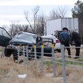 A state trooper investigates the scene of a one-car accident Tuesday on Interstate 540 north of the ...