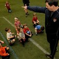 Dave O’Brien, coach of the Arkansas Comets Futbol Club, tells children Tuesday about the next game t...