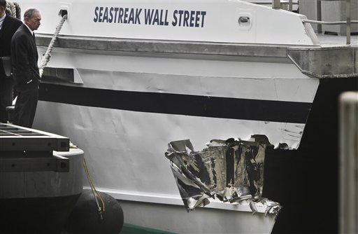 mayor-michael-bloomberg-surveys-the-damage-to-a-passenger-ferry-after-it-crashed-on-wednesday-jan-9-2013-in-new-york-at-least-57-people-were-injured-two-critically-when-a-commuter-ferry-struck-a-dock-in-new-york-citys-financial-district-ripping-open-a-right-side-front-corner