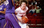 NWA Media/JASON IVESTER -- Arkansas senior Sarah Watkins works around LSU junior Theresa Plaisance during the first half on Thursday, Jan. 10, 2013, at Bud Walton Arena in Fayetteville.