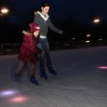Kiera Brown, left, holds on to Amy Brown, both of Springdale, as they ice skate Wednesday at The Rin...