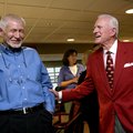 Former Arkansas football coach and athletics director Frank Broyles (right) talks with Loyd Phillips...
