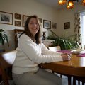 Carolyn Reno sits in her favorite personal space, the dining area of her Fayetteville home.
