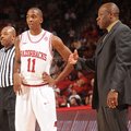 NWA Media/ANDY SHUPE -- Arkansas sophomore guard BJ Young (11) speaks with coach Mike Anderson Satur...