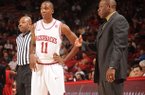 NWA Media/ANDY SHUPE -- Arkansas sophomore guard BJ Young (11) speaks with coach Mike Anderson Saturday, Jan. 5, 2013, during the second half of play against Delaware State in Bud Walton Arena in Fayetteville.