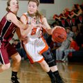 Ashley Ward, a Rogers Heritage senior, tries to drive Tuesday around Springdale High senior Brittany...