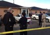 Police talk Friday morning at the scene where two people were killed and one injured in a shooting in Greenland.