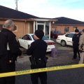 Police talk Friday morning at the scene where two people were killed and one injured in a shooting i...