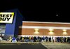 Shoppers wait in line for the midnight opening of a Best Buy Co. store in Peoria, Ill., on Thanksgiving day. A price match program helped its stores’ sales during the holiday season. 