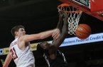 NWA MEDIA/SAMANTHA BAKER -- Arkansas' Hunter Mickelson, left, knocks the ball away from James Siakam of Vanderbilt Saturday, Jan. 12, 2013, during the second half at Bud Walton Arena in Fayetteville.