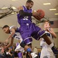 Fayetteville’s Manuale Watkins, center, grabs a rebound over Rogers’ Xavier Smith, right, and Jake K...