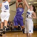 Fayetteville’s Catara Robinson, center, makes a jump shot between Rogers’ McKinzie James, left, and ...