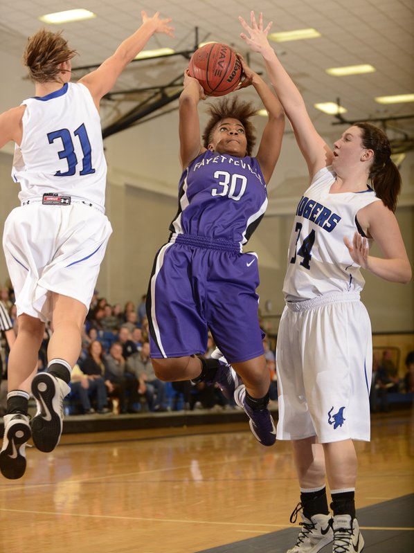 Fayetteville’s Catara Robinson, center, makes ...