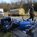 Bella Vista firefighter Lucas Clemmons works the scene of an accident Friday between a motorcycle an...