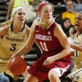 Calli Berna is double-teamed during the Razorbacks' 78-58 loss to Vanderbilt on Sunday at Memorial G...