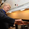Thurman Metcalf stirs a pot of soup Saturday at St. Andrew’s Episcopal Church in Rogers before diner...
