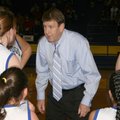 Niven speaks with his players courtside during a game. 