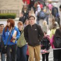 University of Arkansas students cross West Dickson Street in Fayetteville during a class change. A l...