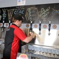 Jesse Core pours a sample beer Friday at his microbrewery, Core Brewing Company, in Springdale. The ...
