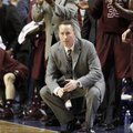 Texas A&M head coach Billy Kennedy, bottom center, watches the closing moments while the bench celeb...