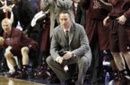 Texas A&M head coach Billy Kennedy, bottom center, watches the closing moments while the bench celebrates behind him late in the second half of an NCAA college basketball game against Kentucky at Rupp Arena in Lexington, Ky., Saturday, Jan. 12, 2013. Texas A&M won 83-71. (AP Photo/James Crisp)