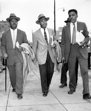 The Rev. Ralph Abernathy (from left), Rev. Dr. Martin Luther King, Jr., and Bayard Rustin, leaders of the bus boycott in Montgomery, Ala., in 1956, leave the Montgomery County Courthouse after appearing in court. 