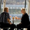 Ronnie Ridley (left) of Fayetteville and Pat Henson of Wagoner, Okla., enjoy lunch Monday at Eleven,...