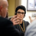 Wendi Cheatham, Bentonville School Board member, listens as Michael Poore, left, Bentonville Public ...