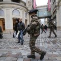 French army soldiers patrol along a main department store in Paris, Tuesday Jan. 15, 2013. Armed sol...