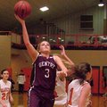 Photo by Randy Moll -- Gentry senior guard Tara Arnold attempts a shot over Gravette senior Destaney...