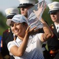 Ai Miyazato holds up the trophy after winning the Walmart NW Arkansas Championship on July 1, 2012 a...