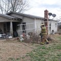 Wade Canfield, left, and Tyer Cray, both Northeast Benton County firefighters, remove equipment Tues...