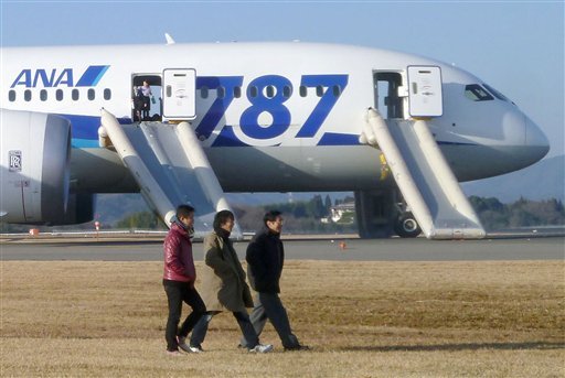 in-this-photo-taken-by-a-passenger-and-distributed-by-japans-kyodo-news-passengers-leave-an-all-nippon-airways-boeing-787-after-it-made-an-emergency-landing-at-takamatsu-airport-in-takamatsu-kagawa-prefecture-western-japan-wednesday-jan-16-2013-ana-said-a-cockpit-message-showed-battery-problems-and-a-burning-smell-was-detected-in-the-cockpit-and-the-cabin-forcing-the-787-on-a-domestic-flight-to-land-at-the-airport