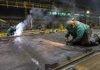 Welders work on sides for refrigerated railcars at the Greenbrier Cos.' Gunderson railcar plant in Portland, Oregon, U.S., on Tuesday, Jan. 15, 2013. Industrial production in the U.S. climbed for a second month in December as demand picked up for capital equipment, showing factories strengthened entering 2013. Photographer: Natalie Behring/Bloomberg