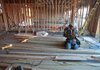 A carpenter works on a new town house in Des Plaines, Ill., on Monday. Home construction jumped in December, the Commerce Department said Thursday. 