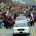 Martin Luther King Jr. is remembered in a previous march up Dickson Street in observance of Martin L...