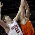 Arkansas' Hunter Mickelson (21) attempts to rebound against Auburn's Rob Chubb (41) during the secon...