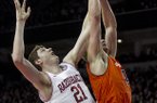 Arkansas' Hunter Mickelson (21) attempts to rebound against Auburn's Rob Chubb (41) during the second half an NCAA college basketball game in Fayetteville, Ark., Wednesday, Jan. 16, 2013. Arkansas defeated Auburn 88-80. (AP Photo/Gareth Patterson)