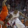 Arkansas' BJ Young, right, dribbles to the basket against Auburn's Josh Wallace during the second ha...