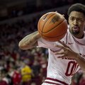 Arkansas' Rashad Madden passes the ball during the first half an NCAA college basketball game agains...