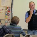 Clayton Scott,
above, teaching artist from Fayetteville, laughs at a joke he made about bees Thursd...